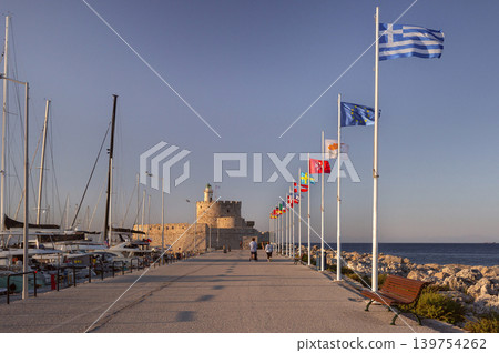 Greek and European Flags Along Mandraki Harbor in Rhodes Greek and European Flags Along Mandraki Harbor in Rhodes 139754262