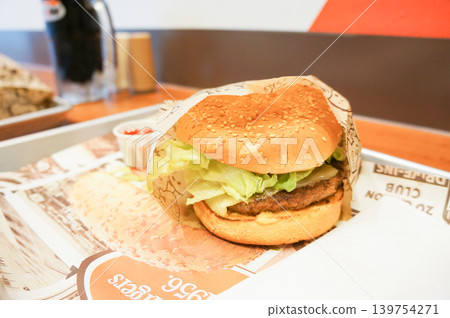 A thick hamburger eaten in a restaurant in downtown Vancouver A thick hamburger eaten in a restaurant in downtown Vancouver 139754271