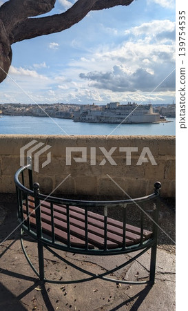A bench and the view of Grand Harbour from the hill in Valletta A bench and the view of Grand Harbour from the hill in Valletta 139754535
