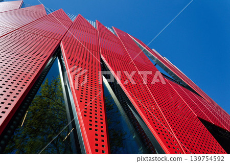 Exterior view of Horacka multifunctional arena in Jihlava, Vysocina region, Czechia, on a sunny day, showing modern architecture from open public surroundings Exterior view of Horacka multifunctional arena in Jihlava, Vysocina region, Czechia, on a sunny day, showing modern architecture from open public surroundings 139754592