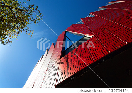 Exterior view of Horacka multifunctional arena in Jihlava, Vysocina region, Czechia, on a sunny day, showing modern architecture from open public surroundings Exterior view of Horacka multifunctional arena in Jihlava, Vysocina region, Czechia, on a sunny day, showing modern architecture from open public surroundings 139754594