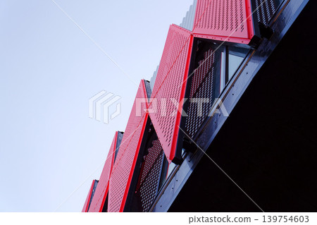 Exterior view of Horacka multifunctional arena in Jihlava, Vysocina region, Czechia, on a sunny day, showing modern architecture from open public surroundings Exterior view of Horacka multifunctional arena in Jihlava, Vysocina region, Czechia, on a sunny day, showing modern architecture from open public surroundings 139754603