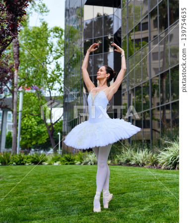 Ballerina posing on pointe on lawn in San Jose Ballerina posing on pointe on lawn in San Jose 139754635