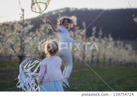 Spring festival, outdoor celebration for young family. Spring festival, outdoor celebration for young family. 139754724