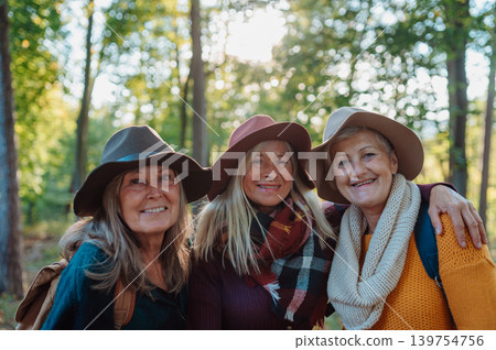 Group of elderly female friends enjoying woodland foraging adventure. 139754756