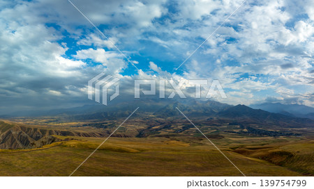 Panoramic Mountain Landscape with Valley and Village in Kyrgyzstan Panoramic Mountain Landscape with Valley and Village in Kyrgyzstan 139754799