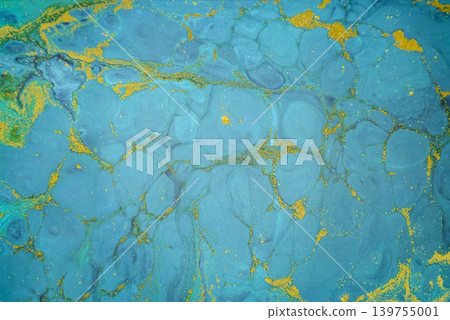 abstract texture of liquid acrylic paint in blue colors with splashes of gold pigment abstract texture of liquid acrylic paint in blue colors with splashes of gold pigment 139755001