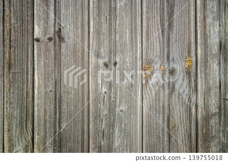 vertical texture of a fence made of grey aged wooden planks vertical texture of a fence made of grey aged wooden planks 139755018