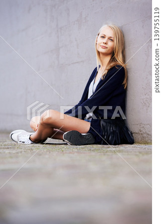 Fashion, portrait and woman by wall in city, relax and outdoor alone. Beauty, style and young person in urban town, casual clothes and blonde girl sitting on the ground on mockup space in Switzerland Fashion, portrait and woman by wall in city, relax and outdoor alone. Beauty, style and young person in urban town, casual clothes and blonde girl sitting on the ground on mockup space in Switzerland 139755119
