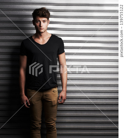 Fashion, style and portrait with man on wall background for student, trendy and casual. Cool, mockup and handsome with young male person in urban outdoors for edgy, serious and stylish clothes Fashion, style and portrait with man on wall background for student, trendy and casual. Cool, mockup and handsome with young male person in urban outdoors for edgy, serious and stylish clothes 139755122
