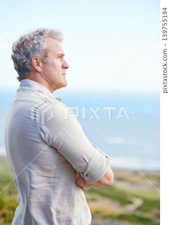 Old man, relax and thinking at beach in retirement with ideas for health, holiday and mindfulness. Mature, person and planning a decision for future in mockup space with blue sky, ocean and sea 139755184