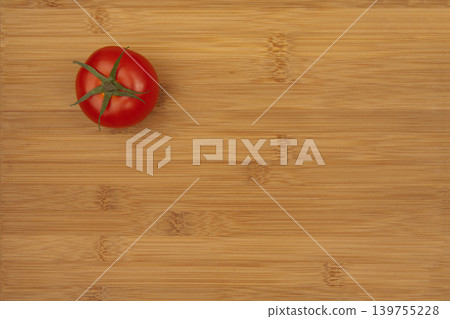 Fresh Tomato on Wooden Bamboo Kitchen Board. 139755228