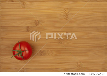 Fresh Tomato on Wooden Bamboo Kitchen Board. Fresh Tomato on Wooden Bamboo Kitchen Board. 139755230