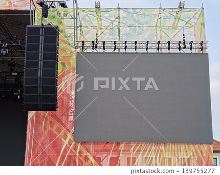 Blank LED screen and line array speaker hanging on an outdoor concert stage Blank LED screen and line array speaker hanging on an outdoor concert stage 139755277