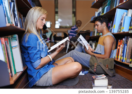 Reading book, woman or students in library at university, college or school campus for education. Bookshelf, learning or people with scholarship studying knowledge, research or information on floor Reading book, woman or students in library at university, college or school campus for education. Bookshelf, learning or people with scholarship studying knowledge, research or information on floor 139755285