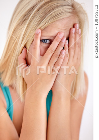 Scared, portrait and woman with hands on face, fear and confused with trauma in horror studio. Panic, scary danger and shocked embarrassed girl with stress, anxiety and terror on white background. Scared, portrait and woman with hands on face, fear and confused with trauma in horror studio. Panic, scary danger and shocked embarrassed girl with stress, anxiety and terror on white background. 139755312