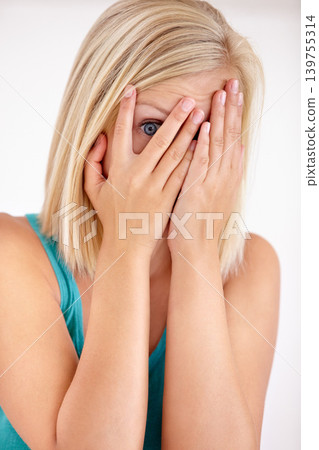 Fear, portrait and woman with hands on face, scared and confused with trauma in horror studio. Panic, scary danger and shocked embarrassed girl with stress, anxiety and terror on white background. 139755314
