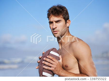 Football, serious man and fitness at the beach on holiday and vacation in Brazil by a sea. Travel, sport and exercise on the sand of a male person with workout, summer and training outdoor by ocean Football, serious man and fitness at the beach on holiday and vacation in Brazil by a sea. Travel, sport and exercise on the sand of a male person with workout, summer and training outdoor by ocean 139755322