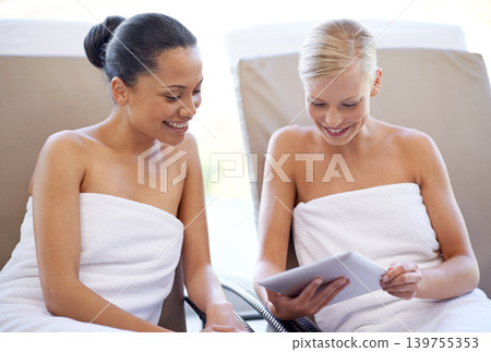 Women, tablet and spa after massage with facial menu or hotel beauty treatment with smile. Relax, calm and happy from physical therapy, care and hospitality from skincare and wellness with people Women, tablet and spa after massage with facial menu or hotel beauty treatment with smile. Relax, calm and happy from physical therapy, care and hospitality from skincare and wellness with people 139755353