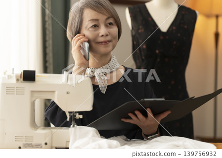 Senior female designers create clothes in their atelier. Senior female designers create clothes in their atelier. 139756932