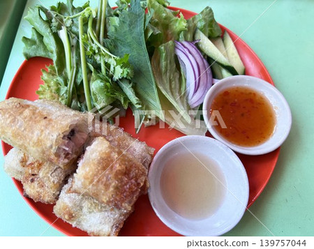 Delicious-looking Thai fried spring rolls and fresh vegetables. Delicious-looking Thai fried spring rolls and fresh vegetables. 139757044