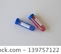 Medical test tubes with red and blue liquid for virus research and laboratory diagnostics. Healthcare composition for virus detection, infectious disease testing and scientific concepts. Hantavirus 139757122