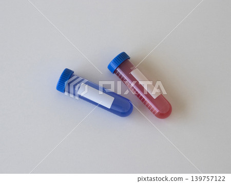 Medical test tubes with red and blue liquid for virus research and laboratory diagnostics. Healthcare composition for virus detection, infectious disease testing and scientific concepts. Hantavirus Medical test tubes with red and blue liquid for virus research and laboratory diagnostics. Healthcare composition for virus detection, infectious disease testing and scientific concepts. Hantavirus 139757122
