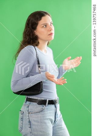Discouraged or puzzled female person is trying to recall necessary information Discouraged or puzzled female person is trying to recall necessary information 139757468