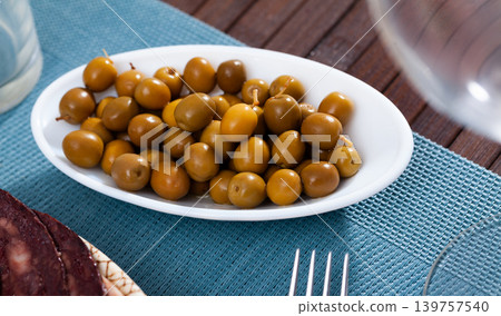 White plate with delicious pitted olives 139757540