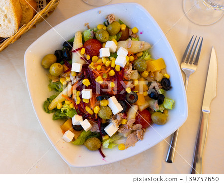 Mediterranean tuna salad with vegetables, olives, feta cheese and peach Mediterranean tuna salad with vegetables, olives, feta cheese and peach 139757650