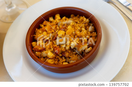 Plate with typical spanish dish migas pastoriles. Spanish cuisine Plate with typical spanish dish migas pastoriles. Spanish cuisine 139757702
