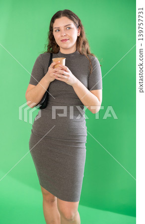 Young woman enjoys hot coffee Young woman enjoys hot coffee 139757731