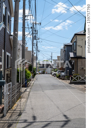 A residential area crisscrossed with power lines. A residential area crisscrossed with power lines. 139757760