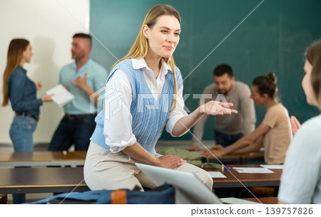 Two positive female students communicate with each other Two positive female students communicate with each other 139757826