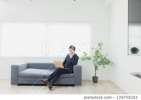Businessman using a personal computer Businessman using a personal computer 139758283