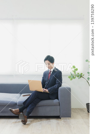Businessman using a personal computer Businessman using a personal computer 139758290