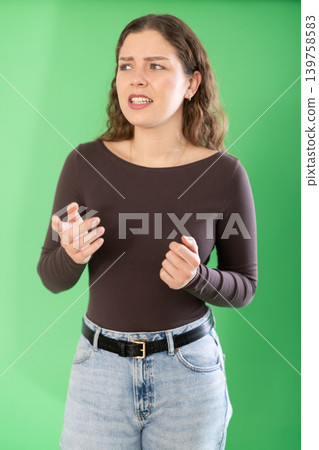 Outraged European young woman is yelling at someone 139758583