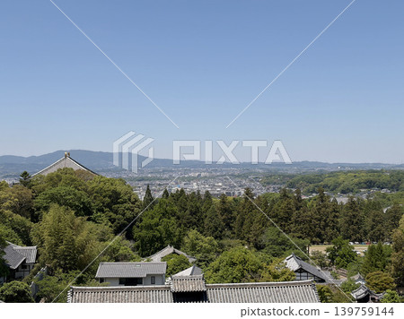 View of Nara city and mountain range from Todai-ji Temple's Nigatsu-do Hall. View of Nara city and mountain range from Todai-ji Temple's Nigatsu-do Hall. 139759144