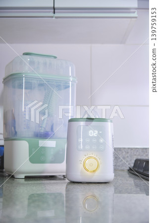 Bottle sterilizer and warmer for baby hygiene set Bottle sterilizer and warmer for baby hygiene set 139759153