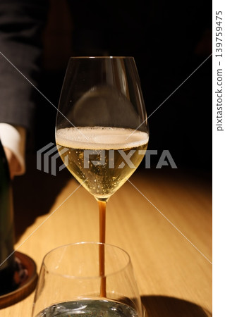 Sparkling Wine Pouring into Glass Close-up Sparkling Wine Pouring into Glass Close-up 139759475