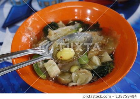 Steamed Dumplings in Broth with Egg Yolk Steamed Dumplings in Broth with Egg Yolk 139759494