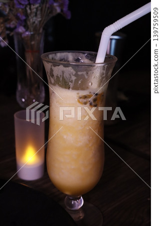 Creamy Beverage with Straw and Candle Background 139759509