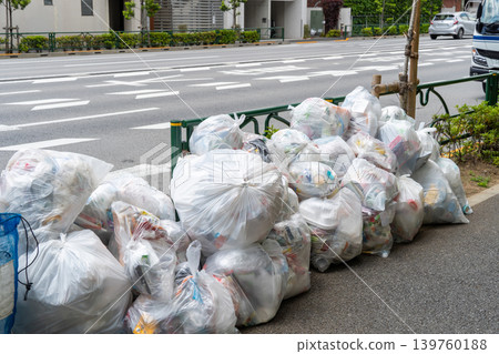 Garbage piled up along the main road Garbage piled up along the main road 139760188