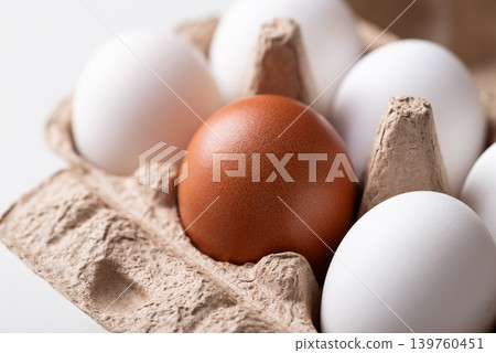 Organic brown and white eggs from free range farm in egg carton 139760451