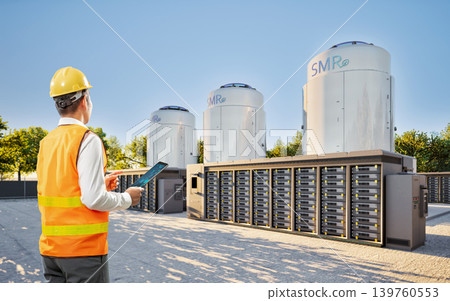 Engineer or technician work at small modular nuclear reactors Engineer or technician work at small modular nuclear reactors 139760553
