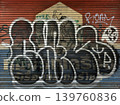 Unauthorized Graffiti on Shophouse Roller Shutter in Bangkok Song Wat 139760836
