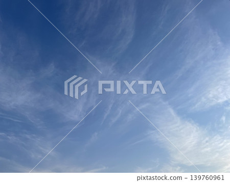 White clouds radiating outwards in the blue sky White clouds radiating outwards in the blue sky 139760961