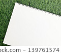 Idea generation in nature and outdoors, messages about ecology and the outdoors, sketchbooks, notebooks on the grass. 139761574
