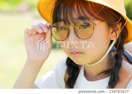 Elementary school student wearing sunglasses Elementary school student wearing sunglasses 139761677