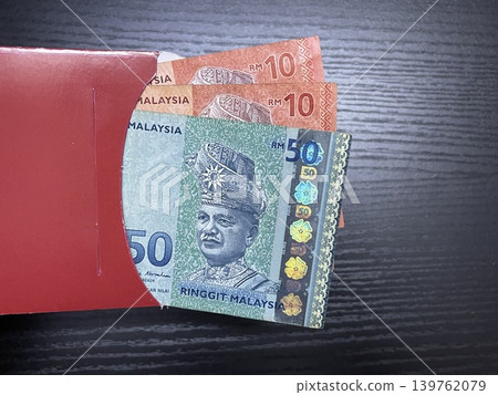 Malaysian Ringgit Banknotes Fifty And Ten In Traditional Red Envelope Angpao 139762079
